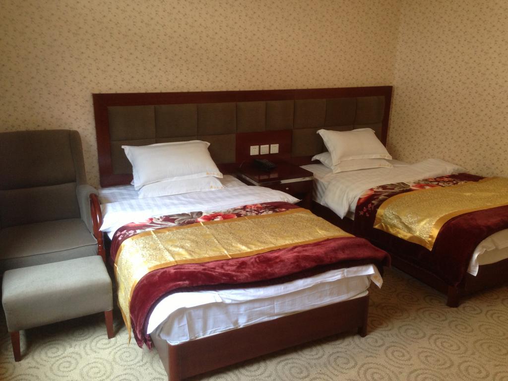 Jiuzhaigou Man Jiang Hong Hotel Quarto foto